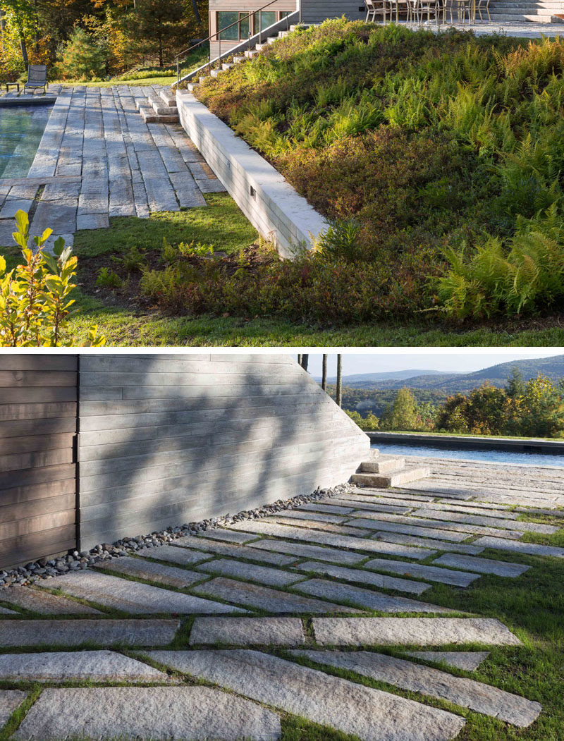 A series of board-formed concrete retaining walls and planted slopes negotiate the outdoor spaces of this modern house, which are overlaid with paths and seating areas using reclaimed granite curbs from Massachusetts and New Hampshire. #Landscaping #Stone #Paths #Garden #RetainingWalls