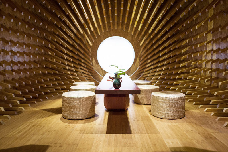 MINAX Architects have designed ONE Teahouse, a modern tea room that has 999 wooden sticks that surround the room, creating a sculptural design. #Teahouse #TeaRoom #InteriorDesign #Interiors #Wood #Sculpture