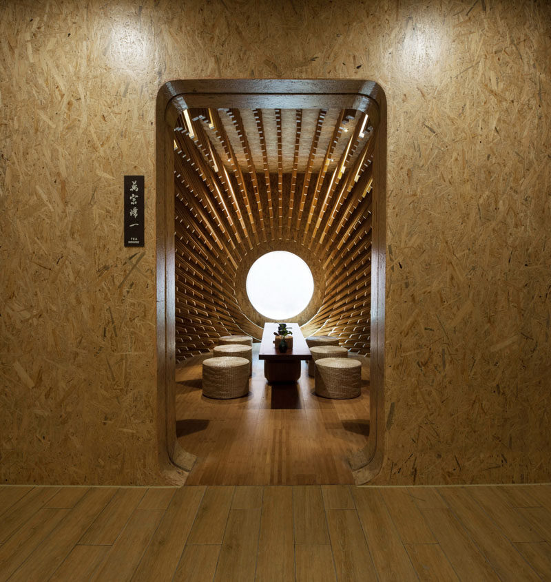 MINAX Architects have designed ONE Teahouse, a modern tea room that has 999 wooden sticks that surround the room, creating a sculptural design. #Teahouse #TeaRoom #InteriorDesign #Interiors #Wood #Sculpture