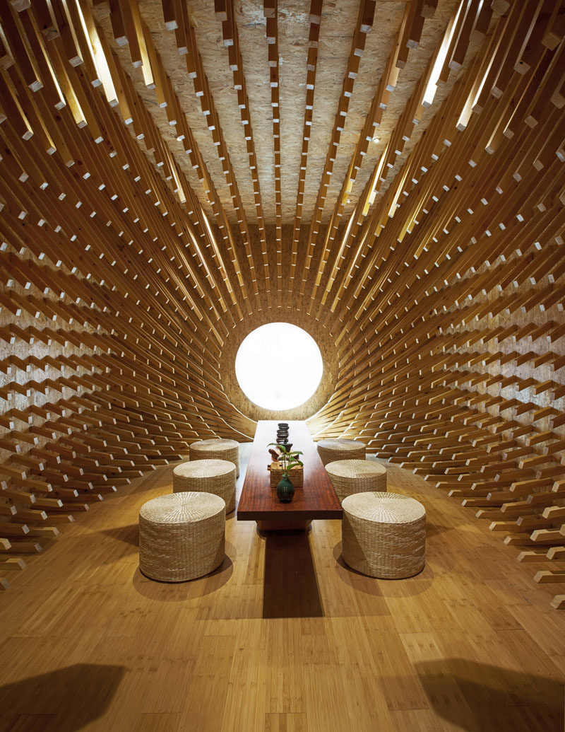 MINAX Architects have designed ONE Teahouse, a modern tea room that has 999 wooden sticks that surround the room, creating a sculptural design. #Teahouse #TeaRoom #InteriorDesign #Interiors #Wood #Sculpture