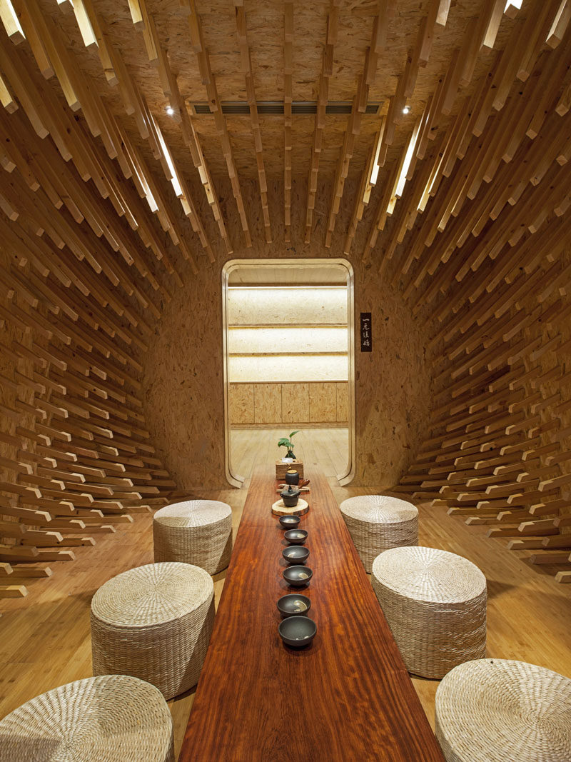MINAX Architects have designed ONE Teahouse, a modern tea room that has 999 wooden sticks that surround the room, creating a sculptural design. #Teahouse #TeaRoom #InteriorDesign #Interiors #Wood #Sculpture