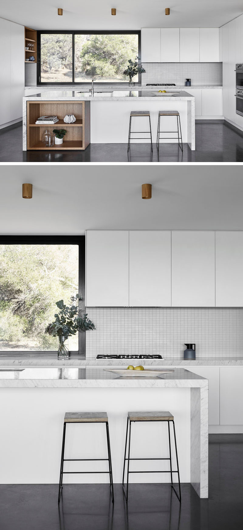 In this kitchen, minimalist white cabinets have been combined with touches of exposed wood shelving, which are both a strong contrast to the dark flooring and window frame. #ModernKitchen #MinimalistKitchen #KitchenDesign #WhiteKitchen