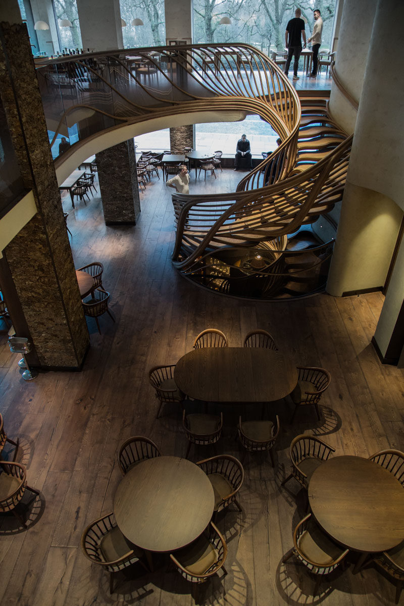 Atmos Studio have designed a sculptural wood spiral staircase that's the centerpiece for the 3-storey HIDE restaurant in London. Click through to see more photos of the staircase. #SpiralStairs #SculpturalStairs #Architecture #Design #WoodStairs