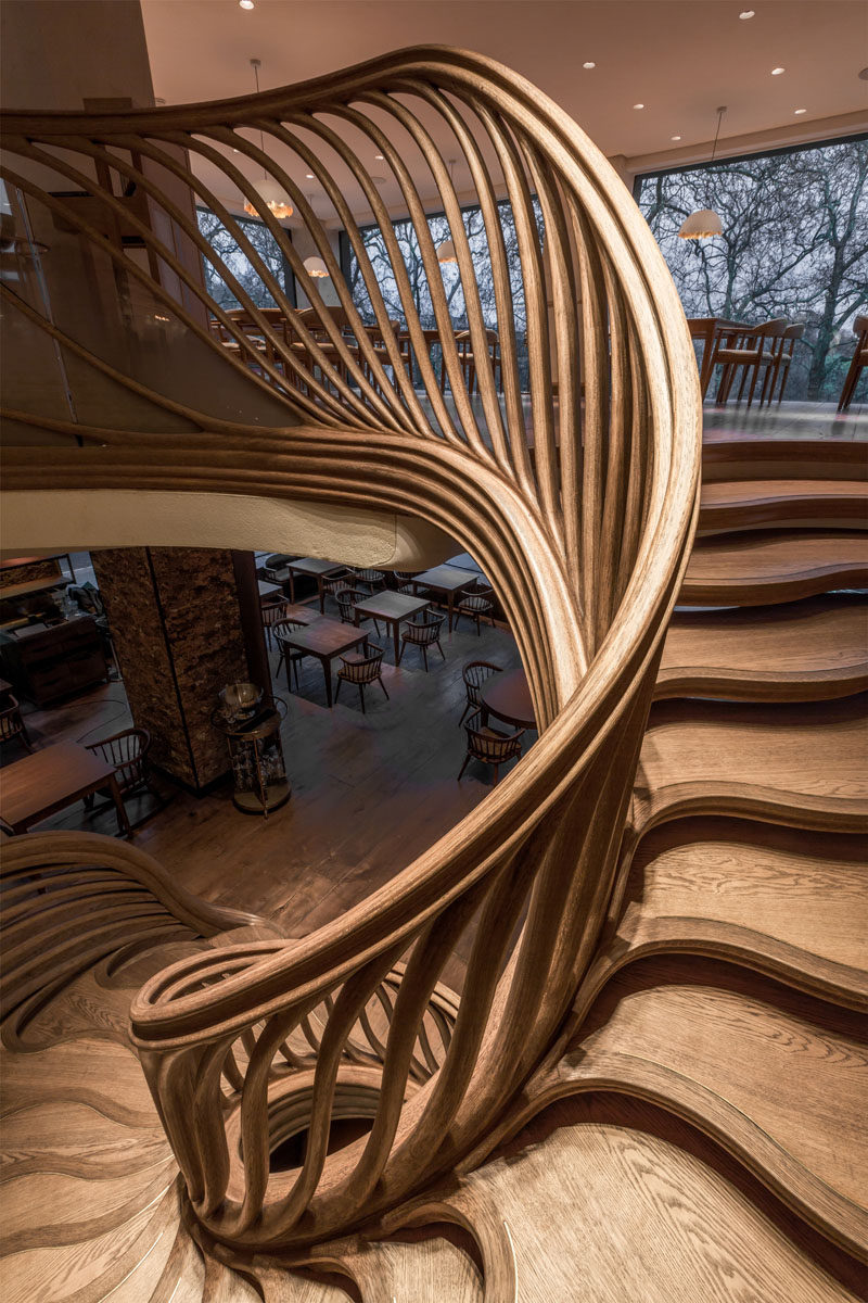 Atmos Studio have designed a sculptural wood spiral staircase that's the centerpiece for the 3-storey HIDE restaurant in London. Click through to see more photos of the staircase. #SpiralStairs #SculpturalStairs #Architecture #Design #WoodStairs