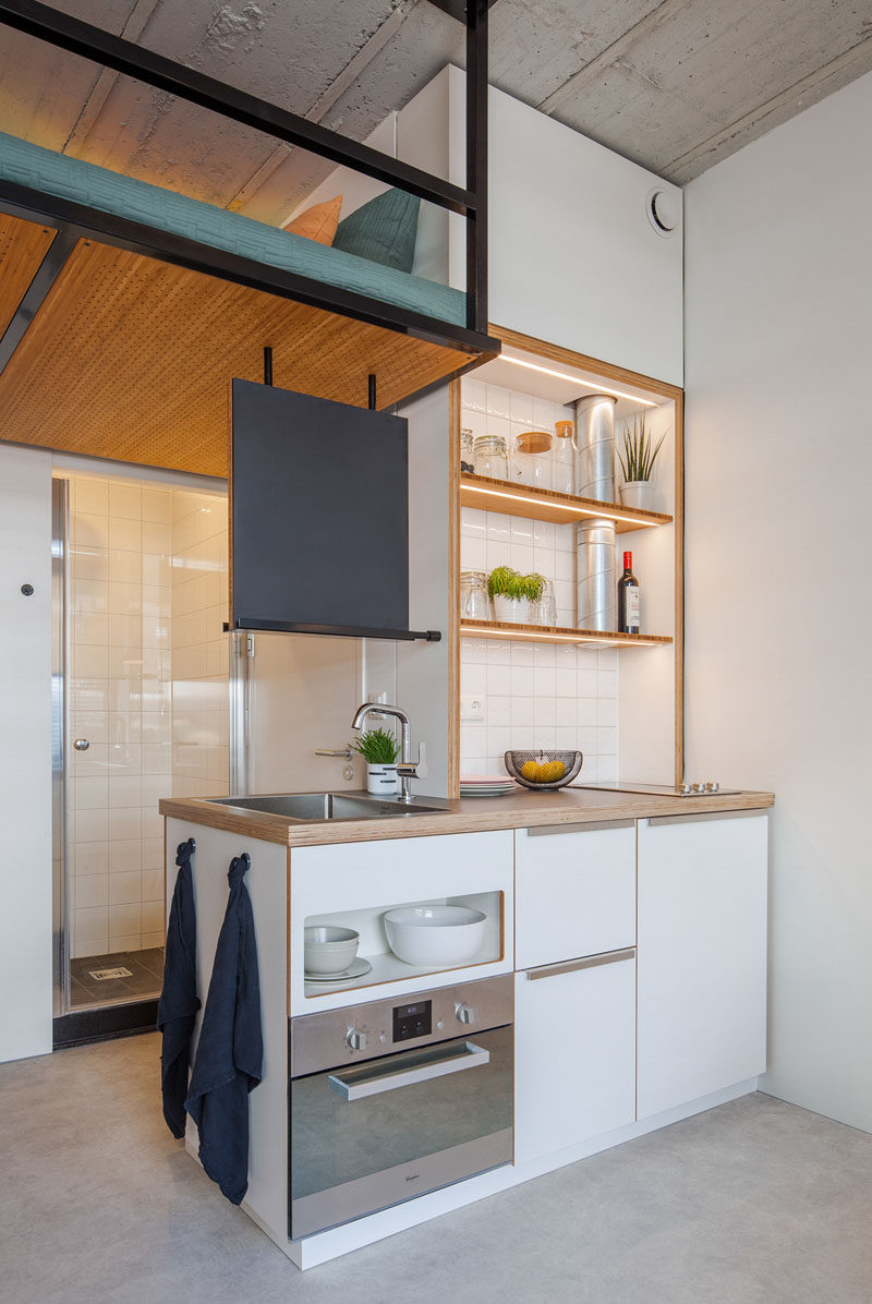 This Small Apartment Has A Loft Bed Suspended From The Ceiling