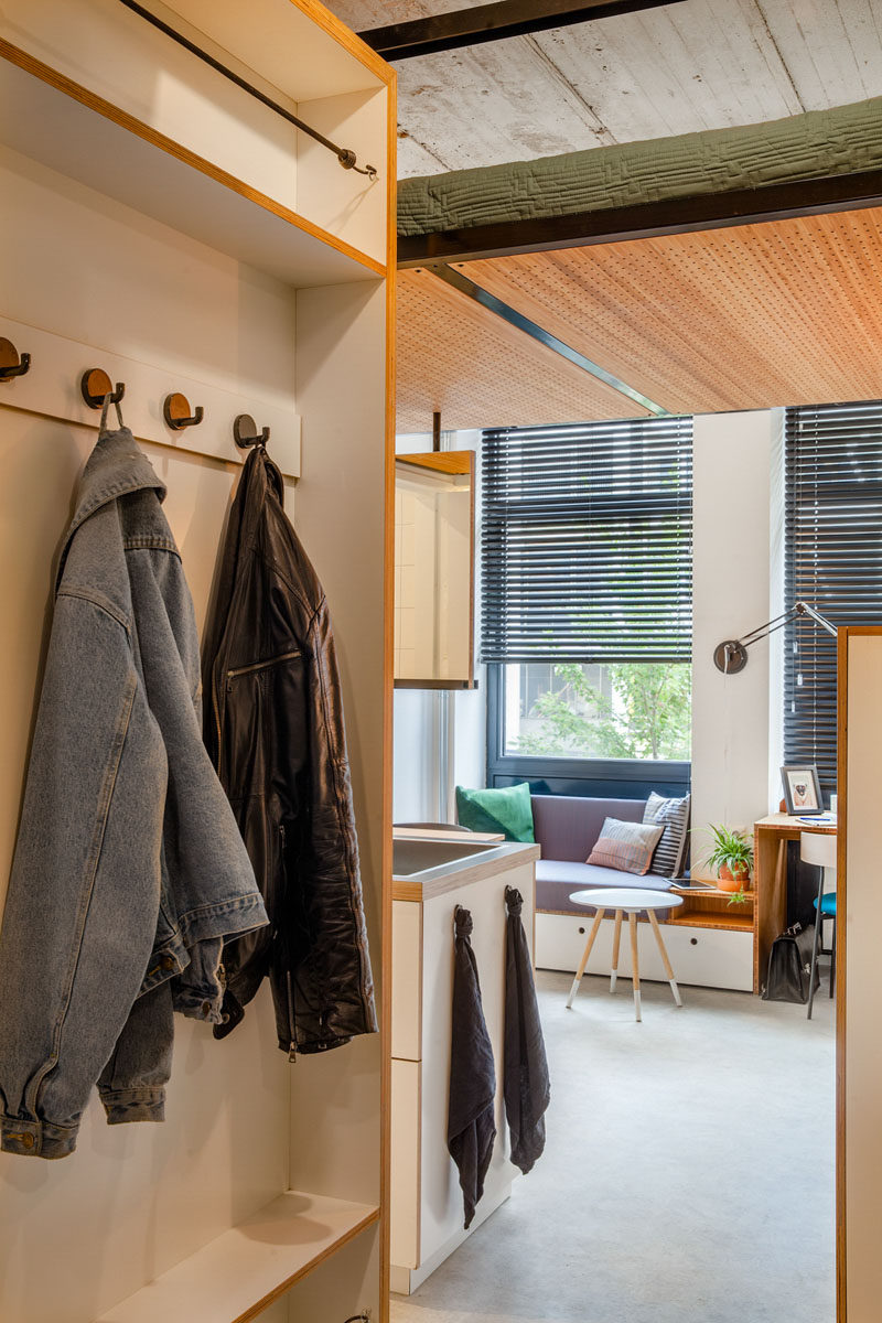 This Small Apartment Has A Loft Bed Suspended From The Ceiling