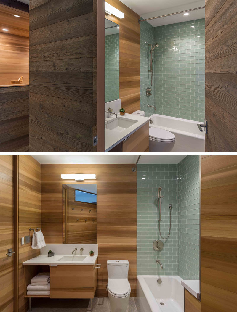 This modern bathroom has cedar clad walls and light green tiles. #ModernBathroom #CedarWalls #CedarBathroom #BlueTiles