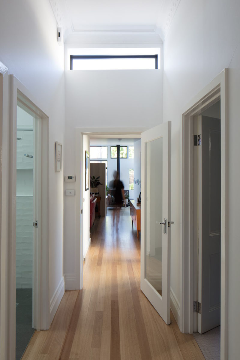 This renovated Australian cottage has light wood floors and a hallway that leads to a new extension. #Hallway #LightWoodFloors