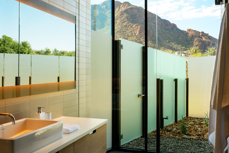 This modern bathroom opens up to a small semi-private courtyard. #ModernBathroom #BathroomDesign