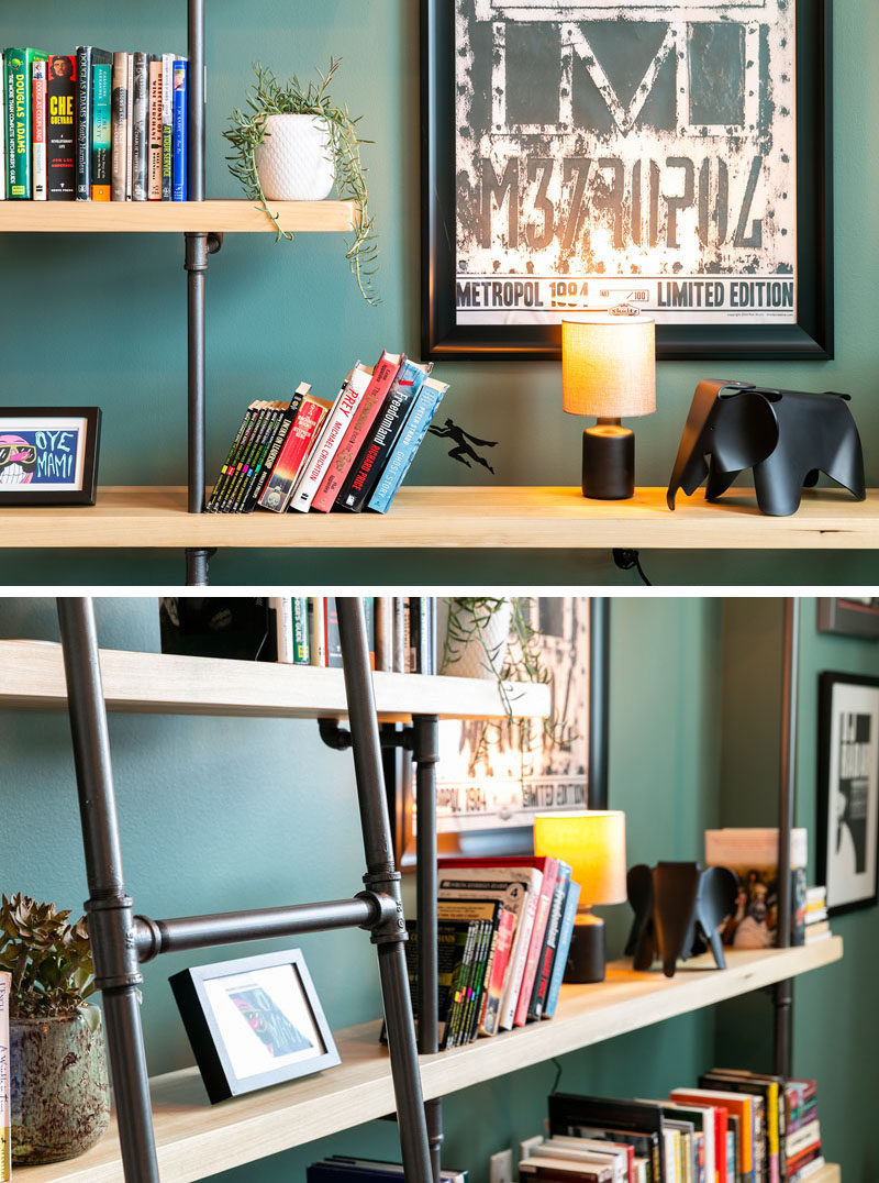 Francis Dominguez has transformed a spare empty bedroom into a library that features wood shelves, a metal ladder, and a reading area. #IndustrialModern #Library #InteriorDesign