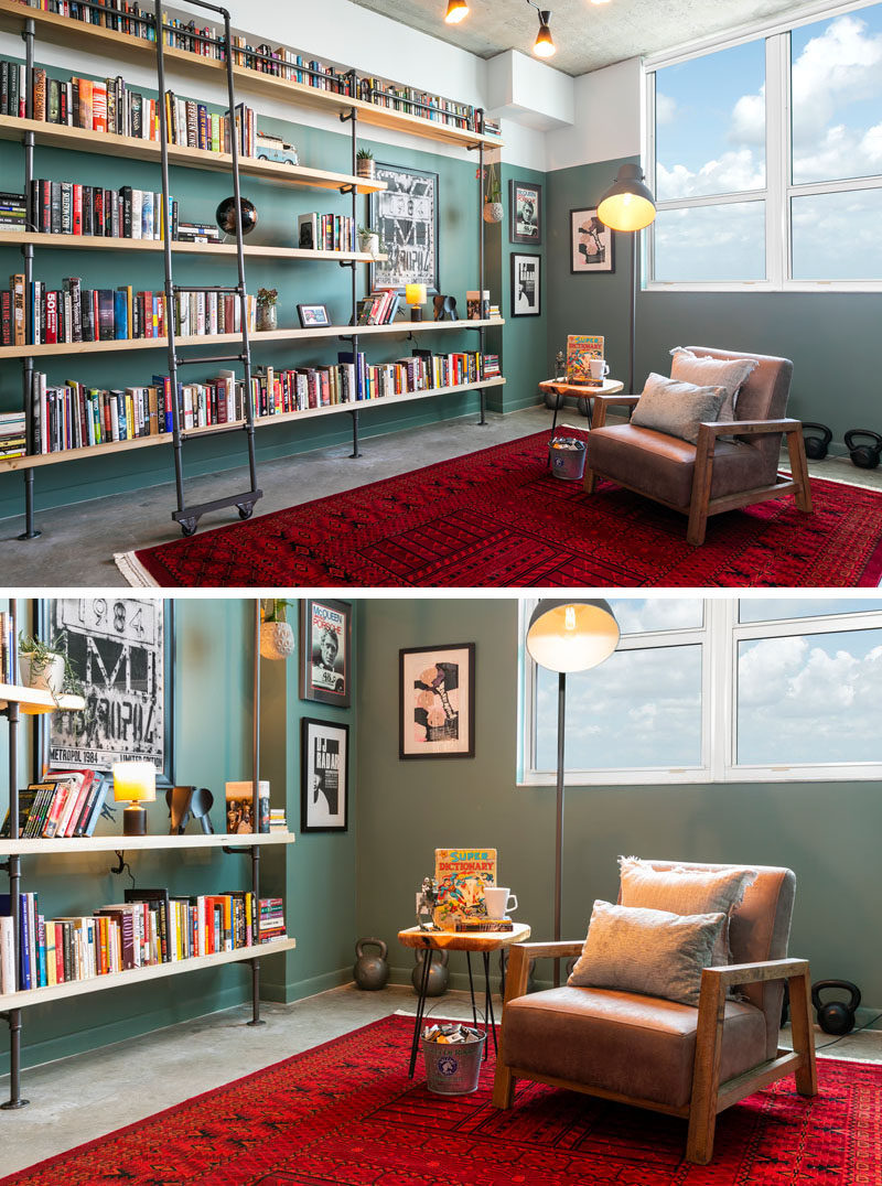 Francis Dominguez has transformed a spare empty bedroom into a library that features wood shelves, a metal ladder, and a reading area. #IndustrialModern #Library #InteriorDesign