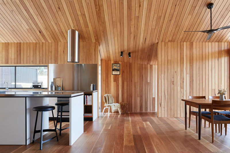 This modern wood-lined house extension is a large open room that houses the kitchen and a dining area.  #WoodInterior #ModernWoodInterior #InteriorDesign