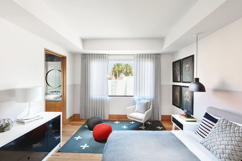 This modern bedroom has enough room to have a reading chair by the window. #ModernBedroom #BedroomDesign