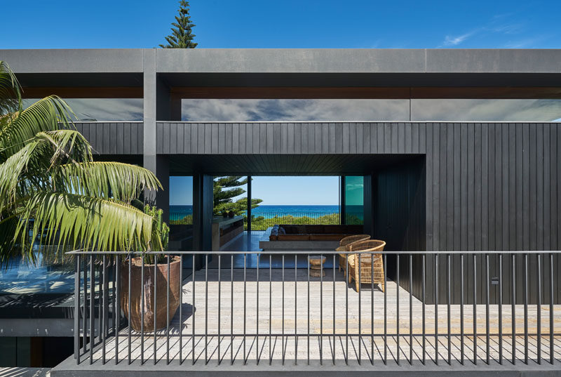 Large sliding glass doors that help to create air flow within this modern beachfront house. #ModernHouse #Architecture