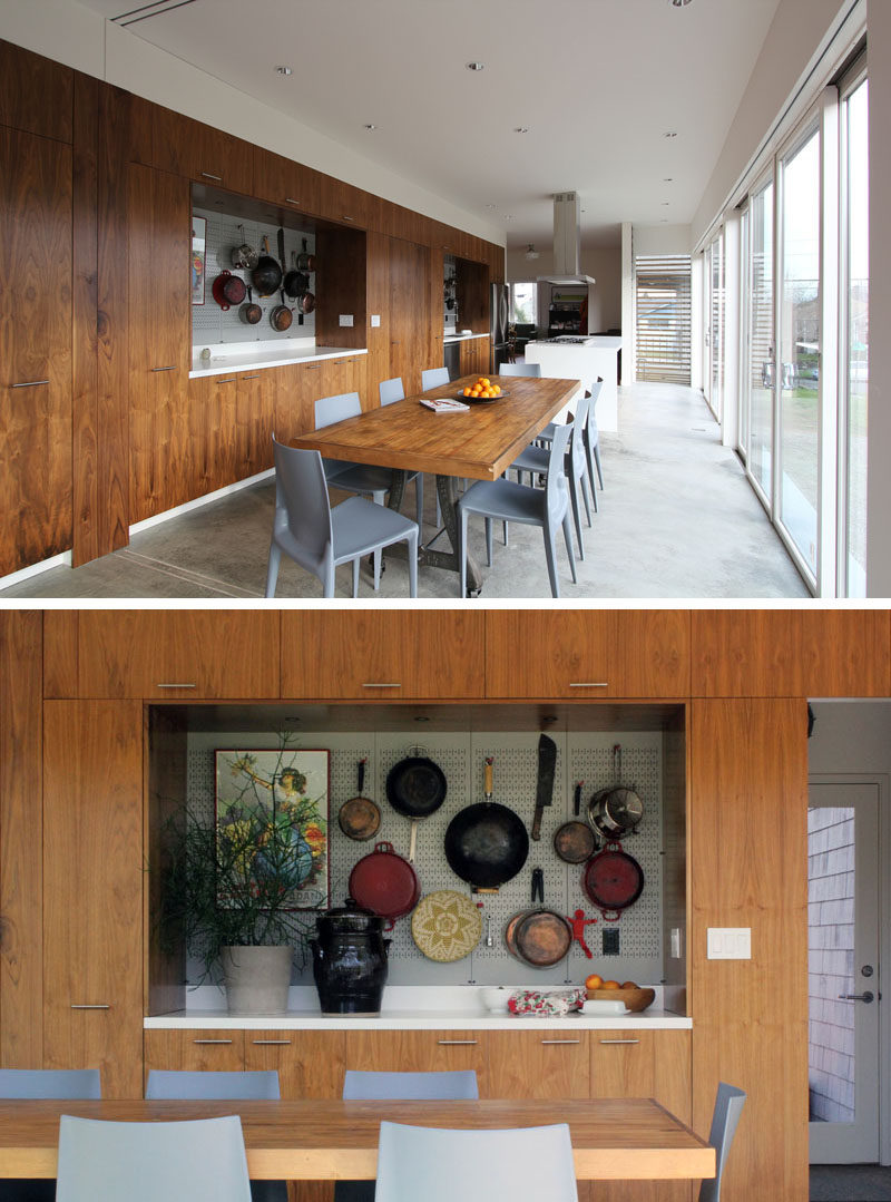 This modern great room consists of an open plan kitchen / dining/ living area, as the home owners love to entertain guests. #OpenPlan #InteriorDesign #DiningRoom #WallDisplay