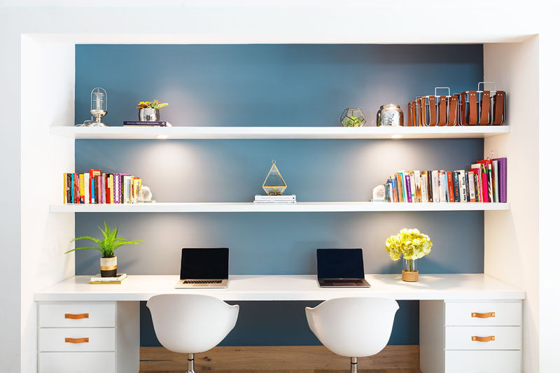 This modern homework station (or home office) has a blue wall that helps to make the white shelving stand out. #HomeworkStation #HomeOffice #BuiltInDesk