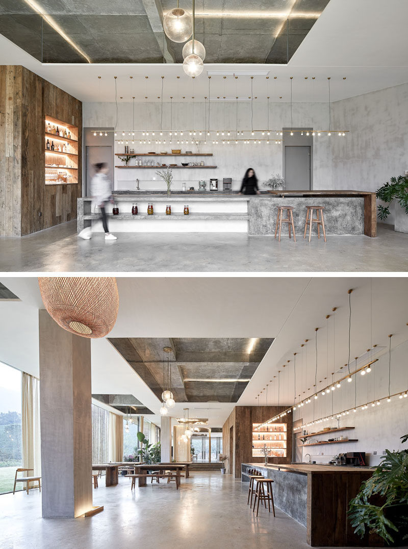 This modern hotel bar and restaurant features a reflective ceiling accent, and a wood shelving unit and bar. #Restaurant #HotelDesign #Bar