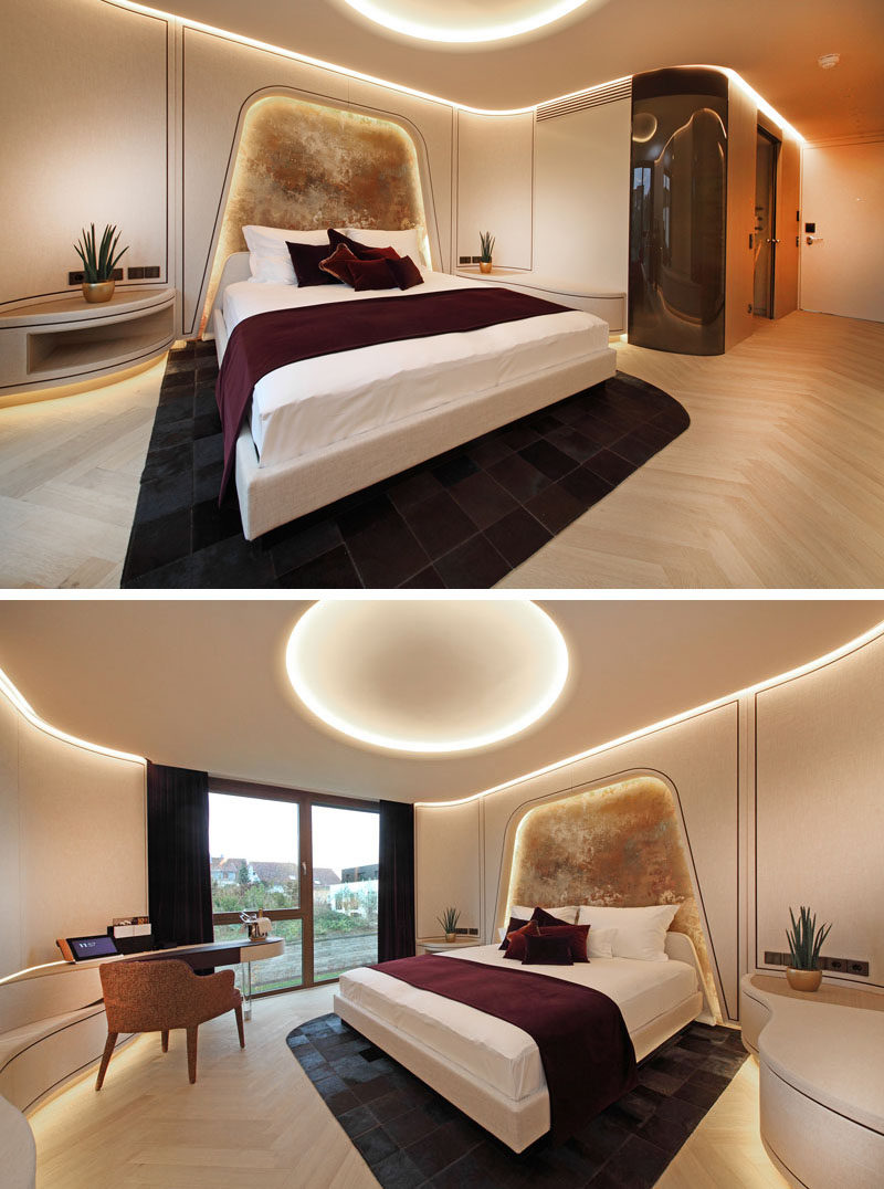 In this modern hotel room, walls have been rounded, and the ceiling design has been highlighted with the use of hidden lighting. #HotelRoom #ModernHotel #HiddenLighting