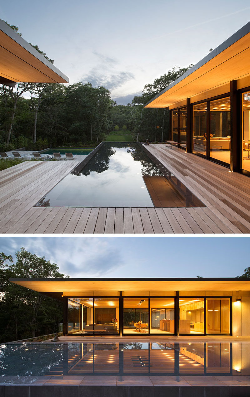 This modern house has a reflecting pool that sits between the two wings of the home. #ReflectingPool #WaterFeature