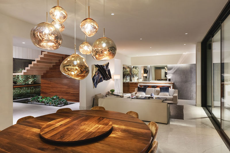 This modern interior features wood elements throughout its design. #ModernInterior #ModernHouseInterior