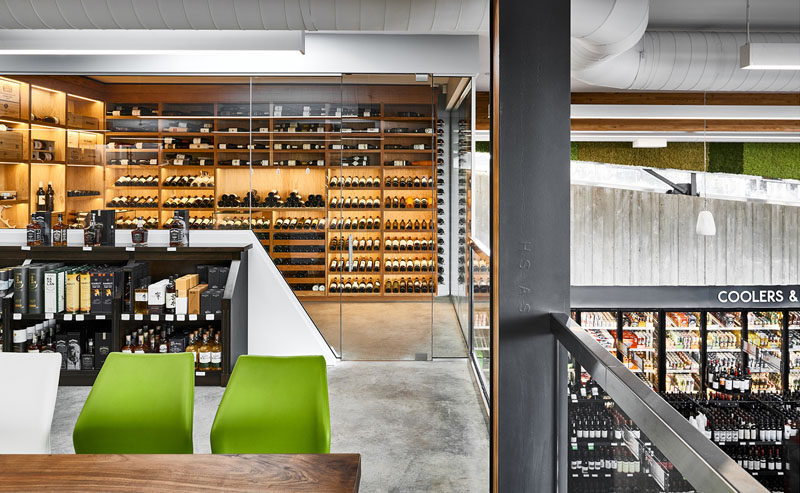 The mezzanine area of this modern liquor store has been designed for the purpose of private tasting events, industry workshops, and neighborhood cultural gatherings. #RetailDesign #LiquorStore #InteriorDesign