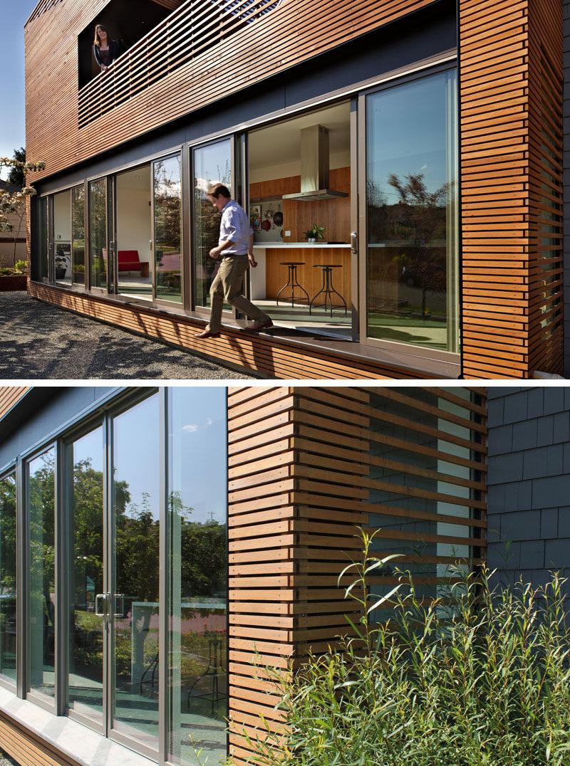 This modern wood covered addition houses a great room that opens to the outside via a 36 foot long operable window wall. #Windows #Doors