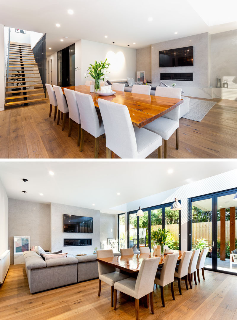 This dining area has a large wood table that separates the living room and the kitchen. #DiningRoom #InteriorDesign