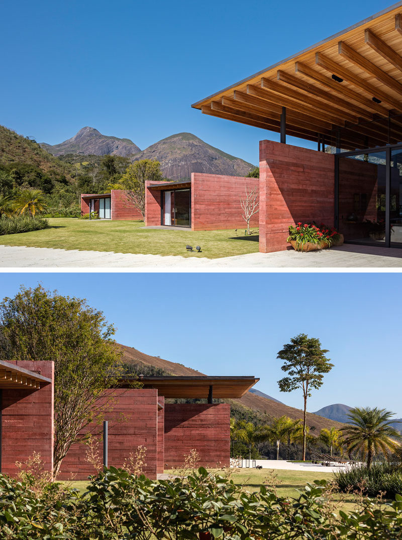 This modern house features pigmented concrete, protruding 'boxes', and an expansive wood roof that sits above the the main form of the house. #Architecture #PigmentedConcrete #ColoredConcrete #WoodRoof