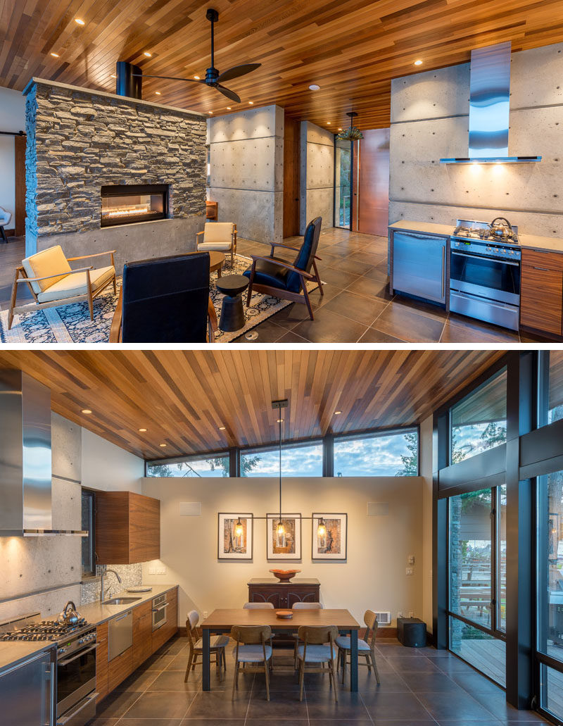 This modern beachfront cottage has been designed as a large open room, with the kitchen, dining, and living area separated from the bedroom by a free-standing double-sided stone and concrete fireplace. #StoneFireplace #InteriorDesign #SmallKitchen #DiningRoom