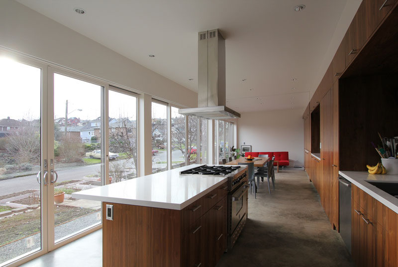 This modern great room consists of an open plan kitchen / dining/ living area, as the home owners love to entertain guests. #OpenPlan #InteriorDesign #Kitchen