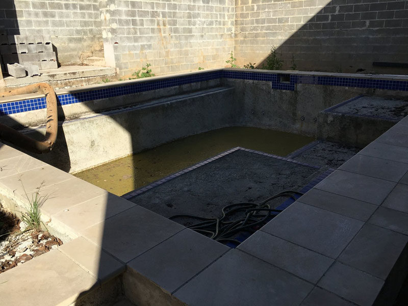 Before & After - the before - this pool area was transformed into a modern and relaxing oasis with a outdoor lounge and built-in planters. #BeforePic #SwimmingPool