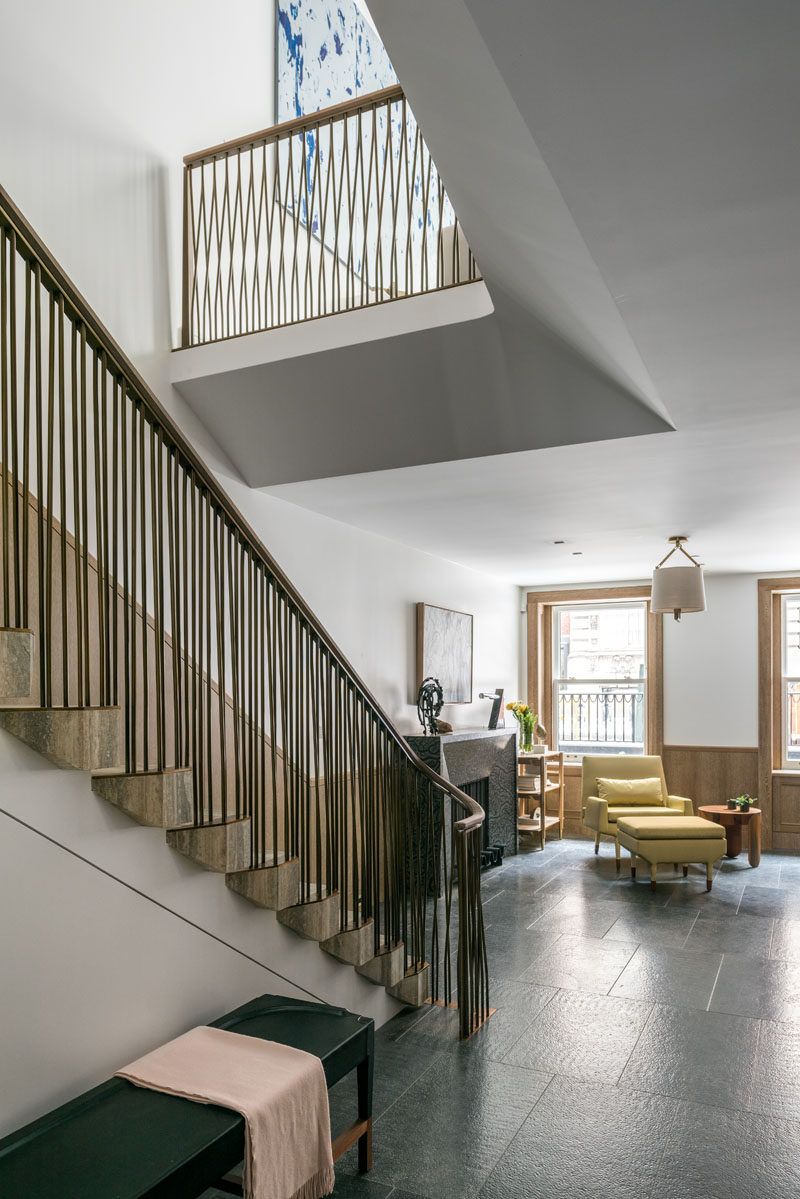 This contemporary row house has open areas that allow light through from the upper levels. #Stairs #InteriorDesign