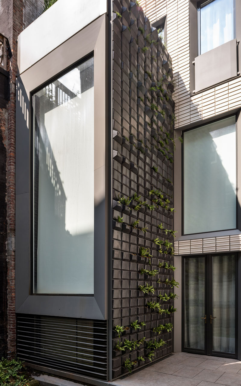 This row house has a custom 35 foot tall vertical garden built into the facade. #GreenWall #VerticalGarden