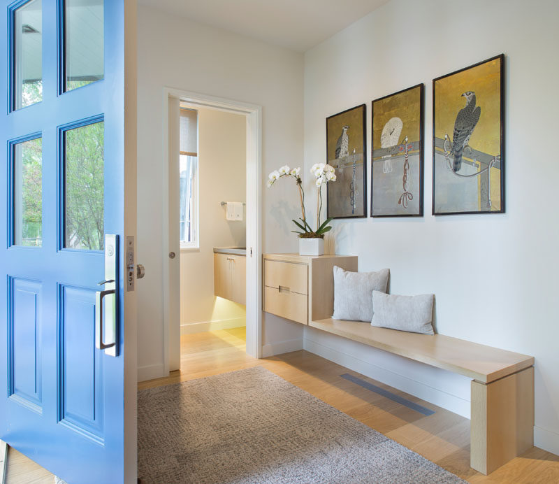 This custom and contemporary wood entryway bench lines up with the vanity in the guest bathroom. #EntrywayBench #EntryBench #InteriorDesign