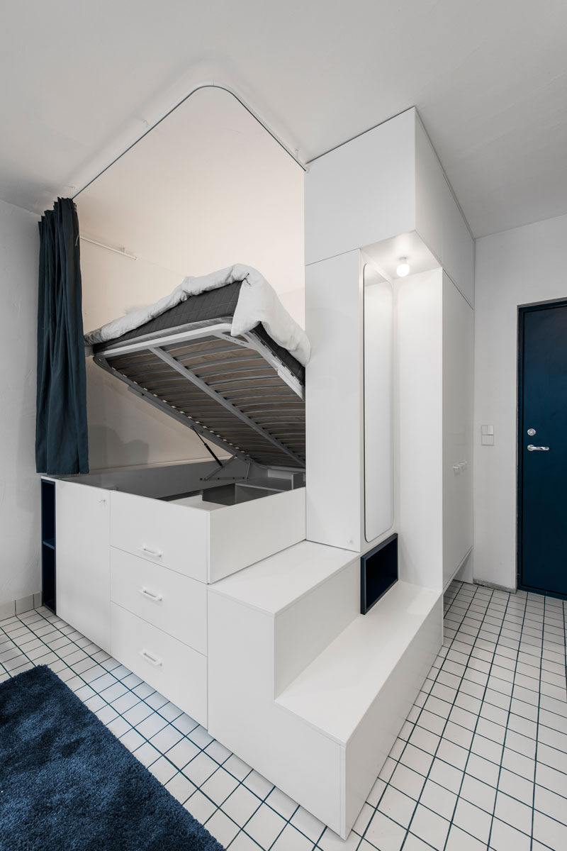 This modern loft bed lifts up to reveal a walk-in closet underneath. #LoftBed #BedWithStorage #Closet #BedWithCloset #Bedroom #ModernBedroom