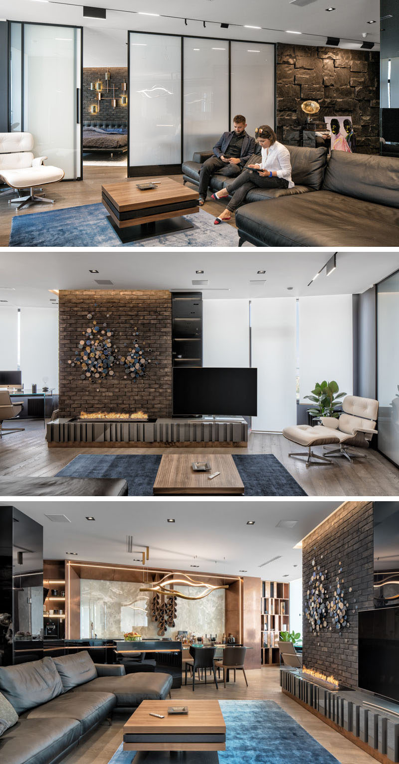 The dark interior palette of this modern apartment uses a variety of materials throughout its design, such as brick, natural African black stone, onyx, leather, copper ,wood etc. It also has a 'smart glass' wall that can change from opaque to transparent. #GlassWall #InteriorDesign #ApartmentDesign #ModernApartment