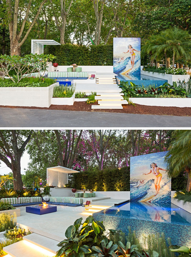 Inspired by the Hawaiian word Ohana, meaning ‘Family’, this modern garden sets out to portray a relaxing family space, specifically geared to the family with teenage kids. It has a pool with a large mural, a dining area with outdoor kitchen, and a lounge area with a firetable. #Landscaping #GardenDesign #Pool #OutdoorDining #LandscapeDesign