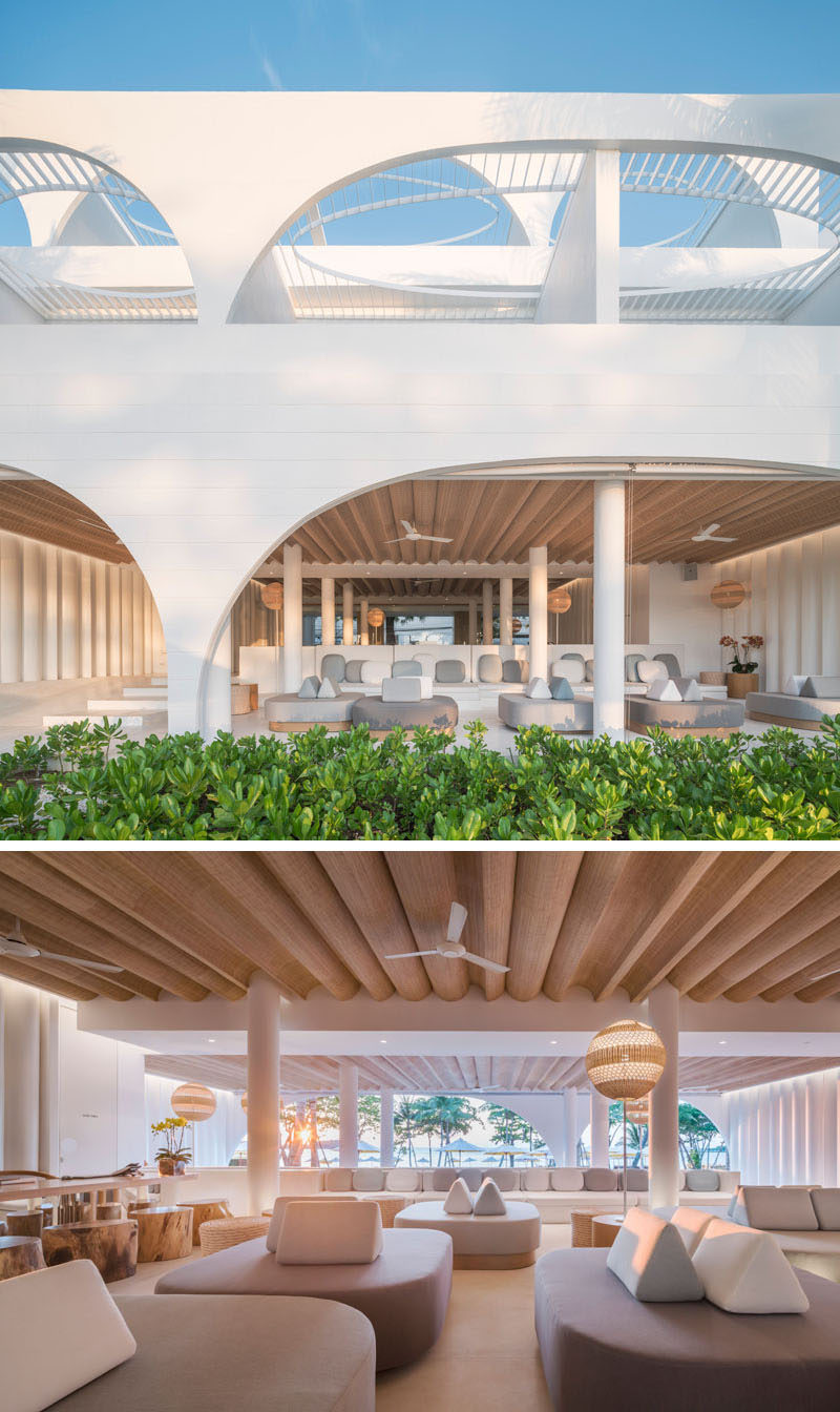 This modern hotel lobby has a lounge area that provides a place for guests to relax in the shade, while curved woven details form a unique ceiling accent. #HotelLobby #HotelDesign #HotelInterior