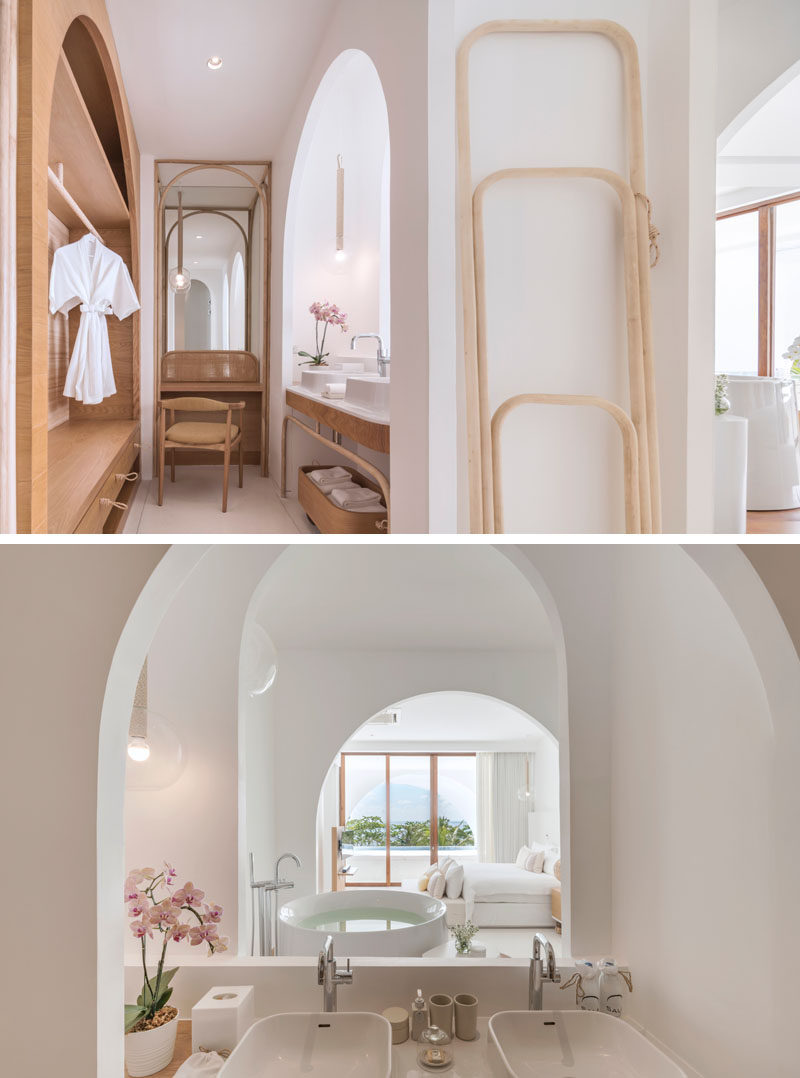 This hotel suite has arches that provide a view from the bathroom all the way through to the private swimming pool. #Bathroom #HotelRoom #Arches