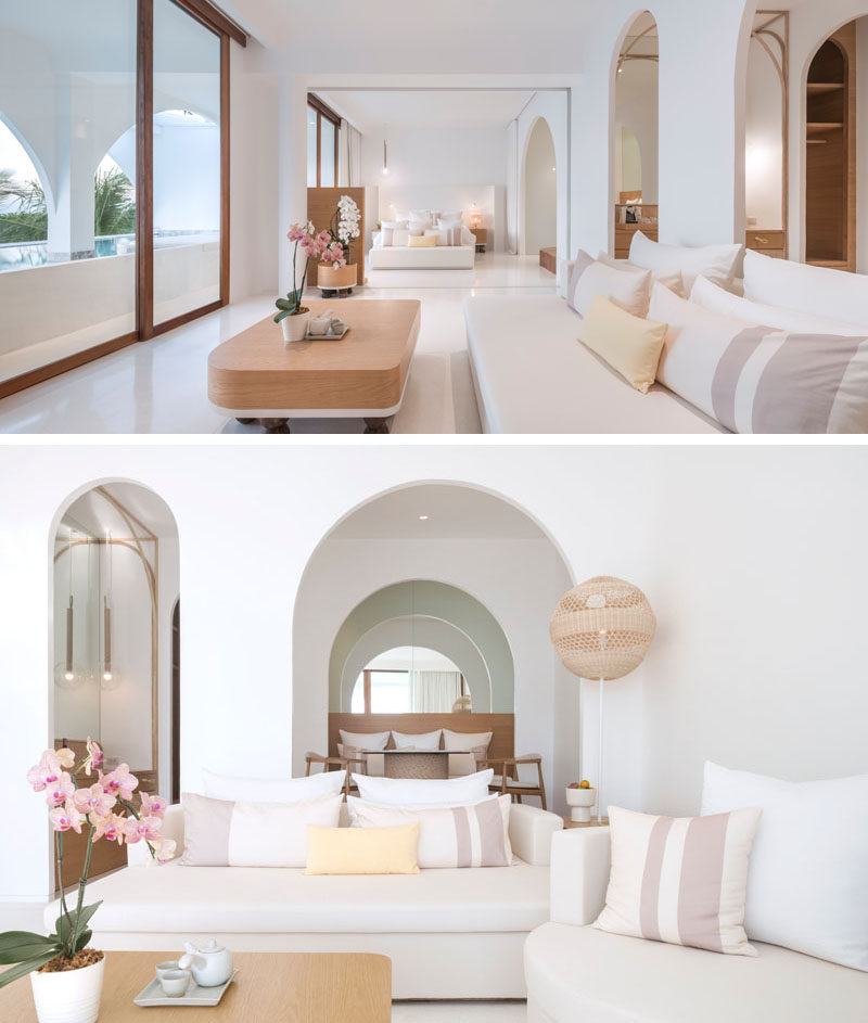 This modern hotel suite has a bright white interior with wood accents and arches, much like the rest of the hotel interior. #HotelSuite #HotelDesign #HotelRoom