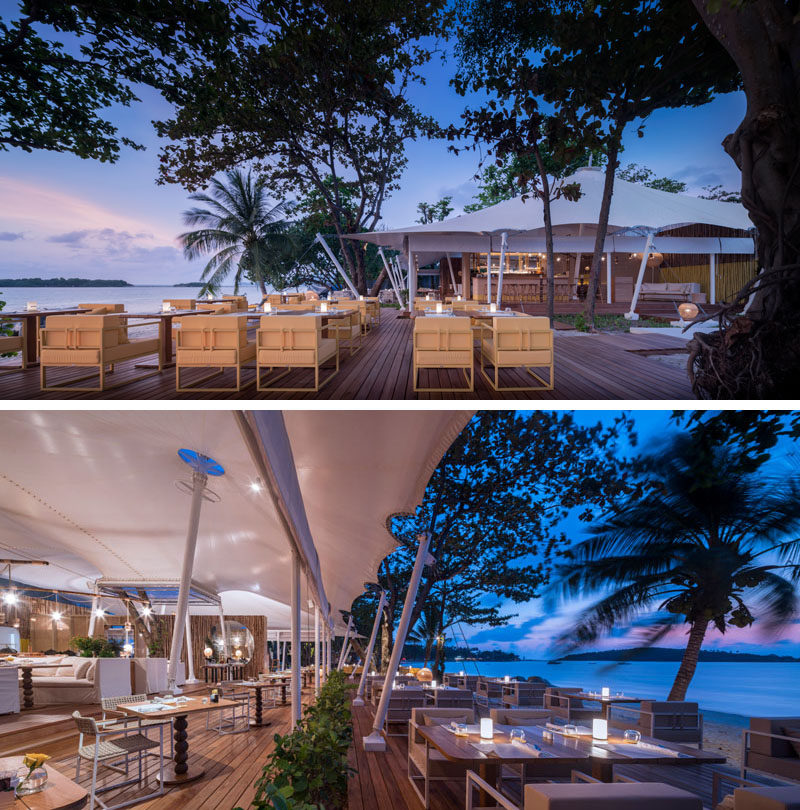 This modern Thai resort has a wooden deck that provides a place to dine outdoors overlooking the ocean. #Restaurant #OutdoorDining #HotelDesign