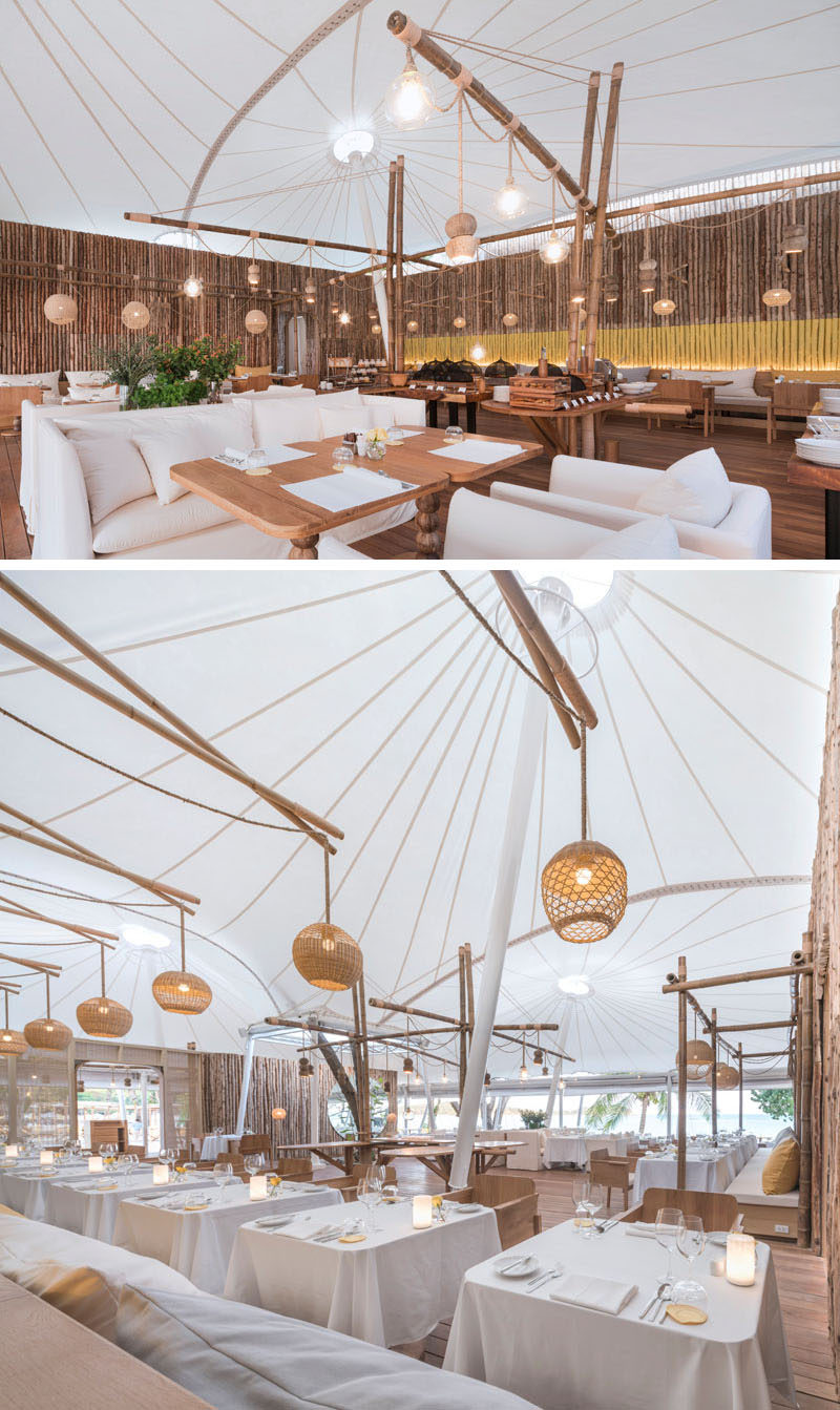 Inside this modern hotel restaurant, bamboo posts cover the walls, while the tent-like structure and woven maps create a relaxed dining environment. #Restaurant #ModernRestaurant #Resort