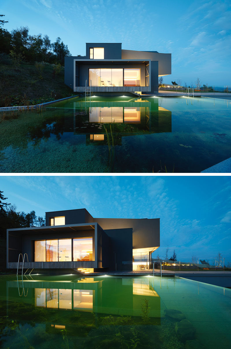 WILLL Architektur have designed a new modern house in Austria, that has a 93 mile panoramic view of the surrounding area and a natural swimming pool. #ModernArchitecture #ModernHouse #NaturalSwimmingPool
