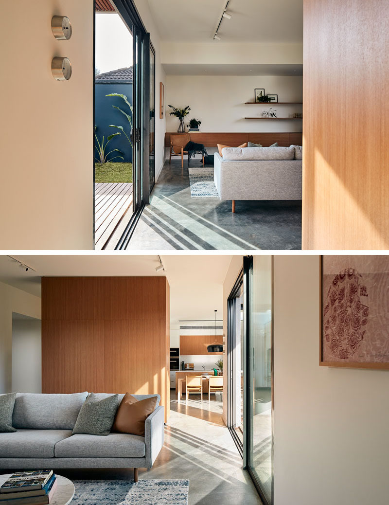 In this living room, simple, comfortable furniture has been combined with a rug and wood elements for a contemporary appearance. #ModernLivingRoom #SlidingDoor