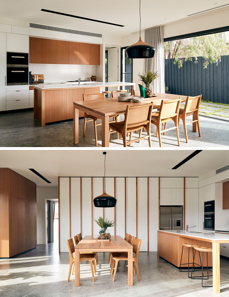 In this modern open-plan kitchen and dining room, light wood furniture and kitchen cabinets contrast the bright white walls. #ModernKitchen #ModernDiningRoom #OpenPlan #InteriorDesign