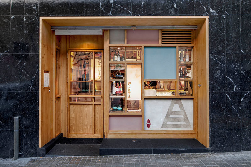 El Equipo Creativo have designed the Pakta Restaurant in Barcelona, Spain, that features an interior with brightly colored ropes. #Restaurant #WoodFacade #RestaurantDesign