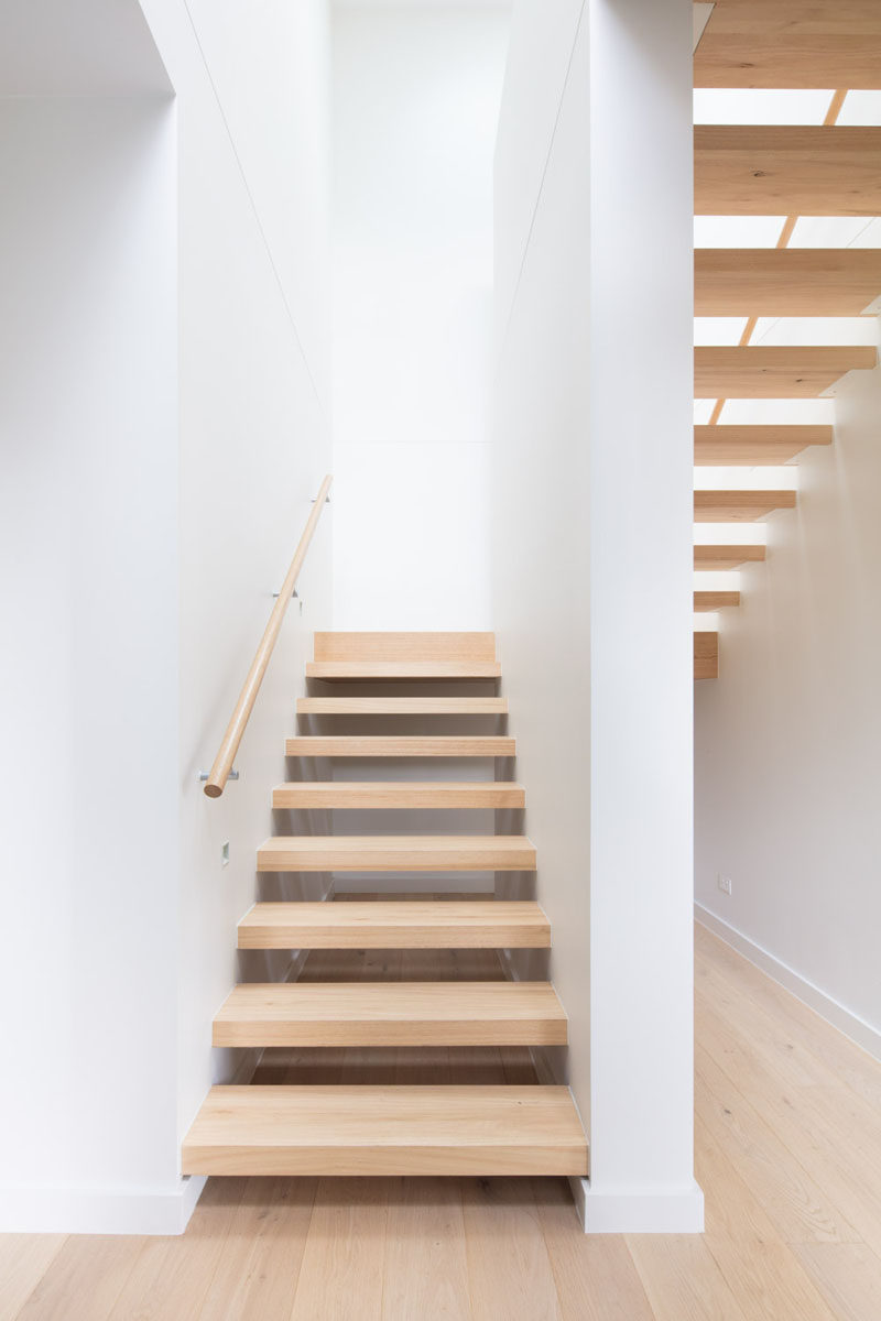 This open tread wood stairs are filled with natural light from a skylight. #Stairs #WoodStairs #OpenTreadStairs