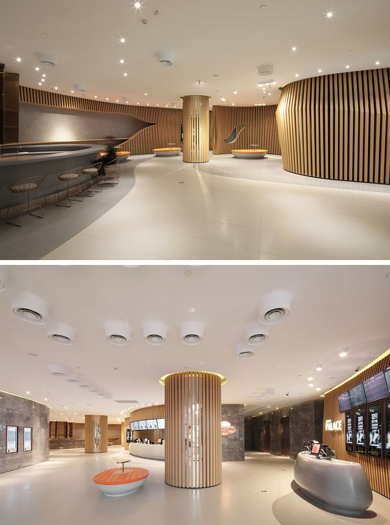 The designers of this modern cinema used wood slats to represent their inspirations, movie scripts and animation flip books. #WoodSlats #Cinema #InteriorDesign #MovieTheatre 