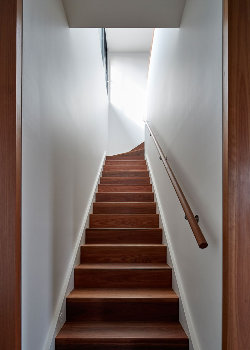 These simple and contemporary wood stairs are made from naturally oiled spotted gum. #WoodStairs #ContemporaryStairs #WoodAndWhite