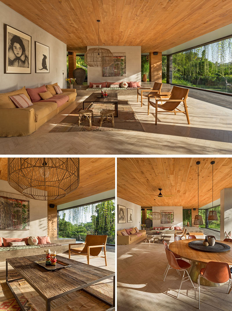 All of the social areas of this modern house, like the living room, have been kept open towards the elements, whereas the bedrooms and other more private spaces such as office, gym, and media room can be closed off. #ModernLivingRoom #WoodCeiling